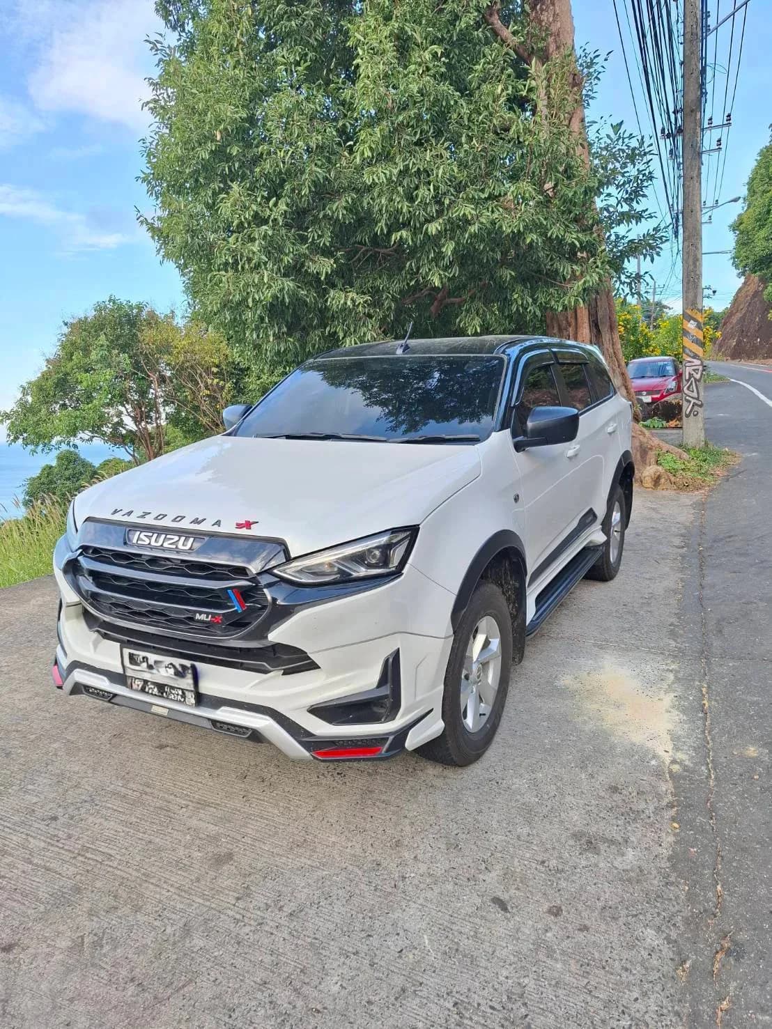 Isuzu MU-X private car with driver